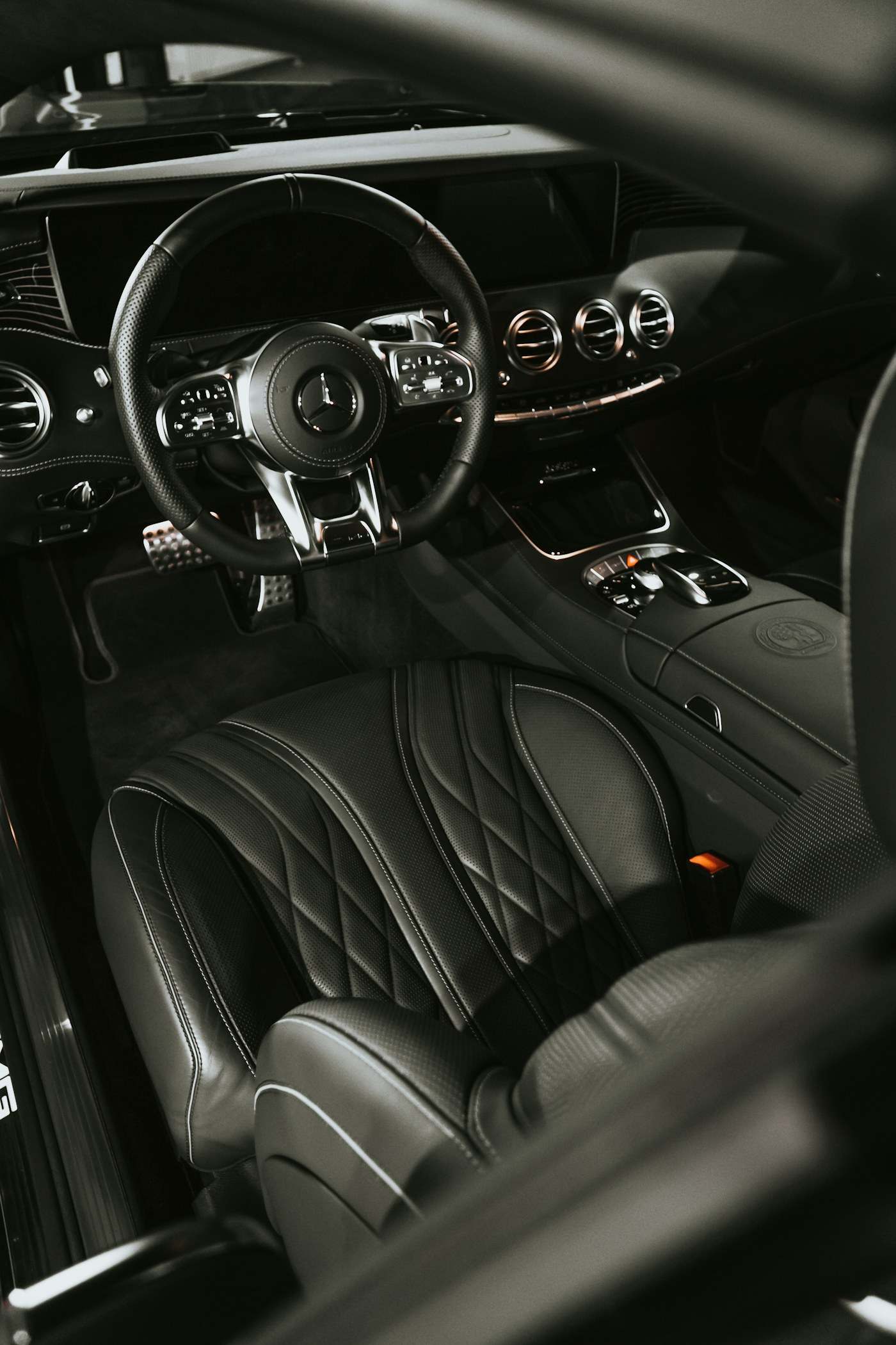 Clean quilted leather seats and steering wheel in a luxury car