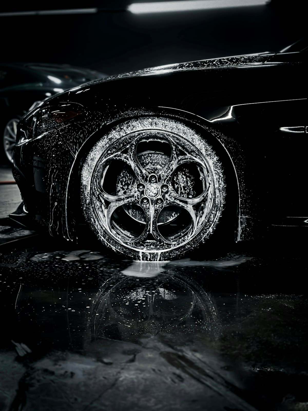 Foam covering a wheel during a hand wash